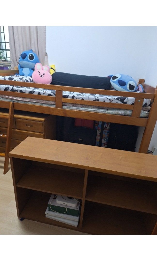 Solid Wood Bed Frame with Bookshelf and Ladder (Category: Bed Frames & Mattresses) located in Manila. Submitted by farmgirl2026 (Listing ID 1466655176, Image 2). Description: - From Japan - Material & Color: Sturdy wooden loft bed finished in a warm brown tone - Includes: Matching open bookshelf unit placed in front - Safety Features: Built-in ladder on the left side and safety rails on the top bunk - Space-Saving: Generous open space underneath 