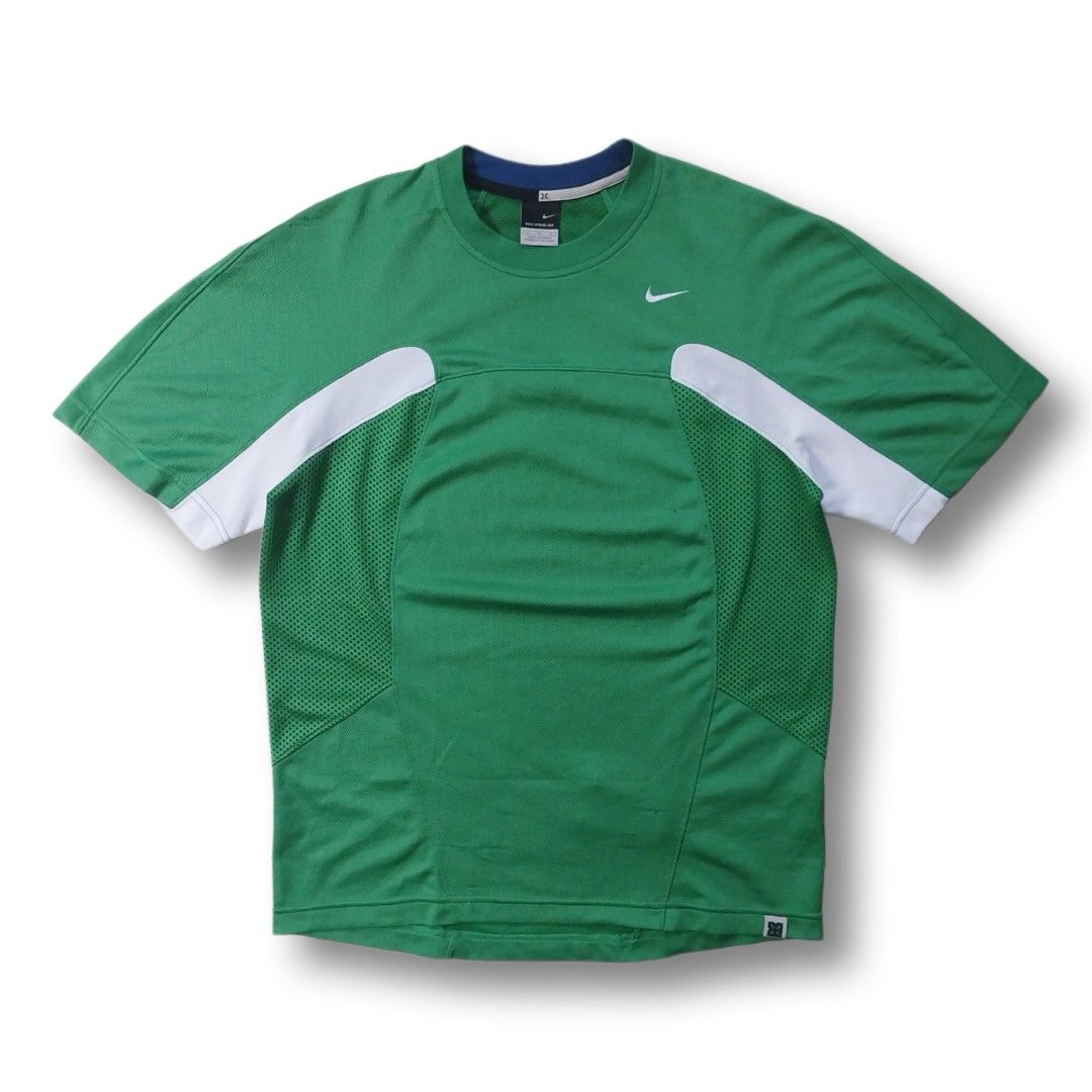 Y2K Nike Sphere Dri-Fit (Category: Activewear) located in Cavite. Submitted by spinfits (Listing ID 1466584503, Image 1). Description: - Brand: Nike - Model/Tech: Sphere Dry - Color: Green with white shoulder accents and blue collar trim - Size: Medium - Features: Breathable mesh panels on sides and back, embroidered Nike swoosh logo on chest Size: S-M (Width: 20") (Lenght: 27") INCHES Condition: (Well used) Color rate: 9/10 Issues: Multiple sign