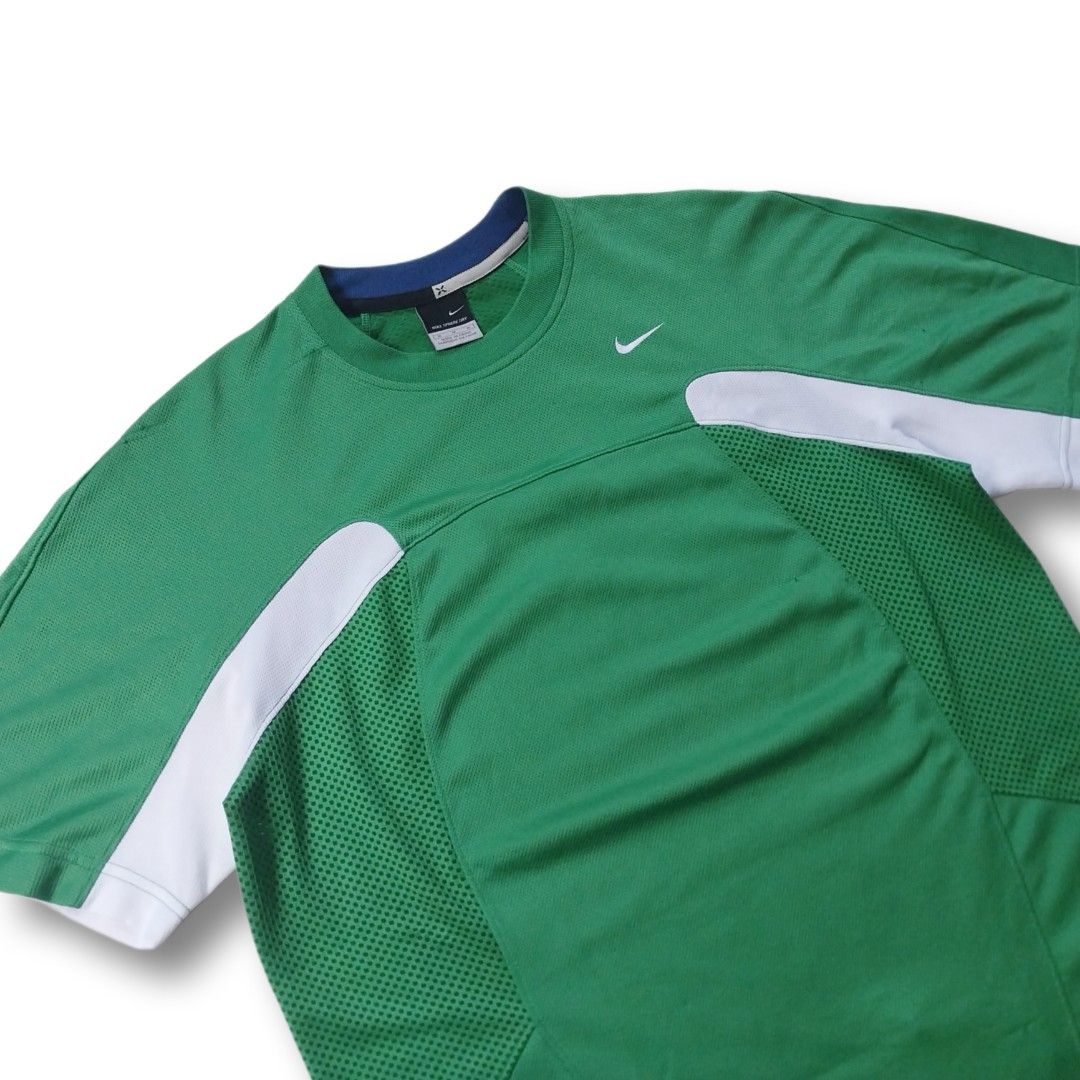 Y2K Nike Sphere Dri-Fit (Category: Activewear) located in Cavite. Submitted by spinfits (Listing ID 1466584503, Image 2). Description: - Brand: Nike - Model/Tech: Sphere Dry - Color: Green with white shoulder accents and blue collar trim - Size: Medium - Features: Breathable mesh panels on sides and back, embroidered Nike swoosh logo on chest Size: S-M (Width: 20") (Lenght: 27") INCHES Condition: (Well used) Color rate: 9/10 Issues: Multiple sign