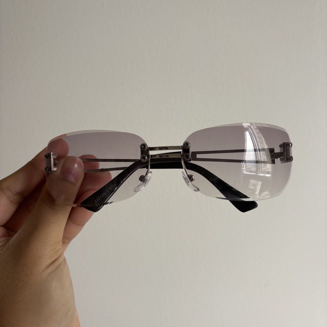 Y2K Rimless Sunglasses & Silver Square Sunglasses Bundle (Category: Sunglasses & Eyewear) located in Pasig City. Submitted by notshynotmeee (Listing ID 1466576624, Image 2). Description: - Bundle of 2 trendy fashion glasses - Pair 1: Rimless gradient tinted lenses in purple-grey with metallic bridge details (Model: JJ2126-1) - Pair 2: Silver rectangular frames with light blue lenses and unique temple cutouts - Perfect accessories for streetwear a