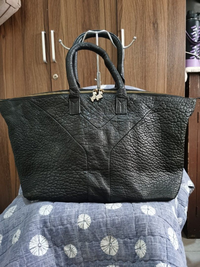 YVES SAINT LAURENT (Category: Tote Bags) located in Bacolod City. Submitted by mzb06 (Listing ID 1466590315, Image 1). Description: SOFT LAMB SKIN LEATHER MATERIAL WITH CODE,Lampo under both zipper.. SPACIOUS LARGE IN SIZE, BEST AS OFFICE BAG,OR COMPUTER BAG OR TRAVEL BAG.. DIMENSION : H 13" / W 21".