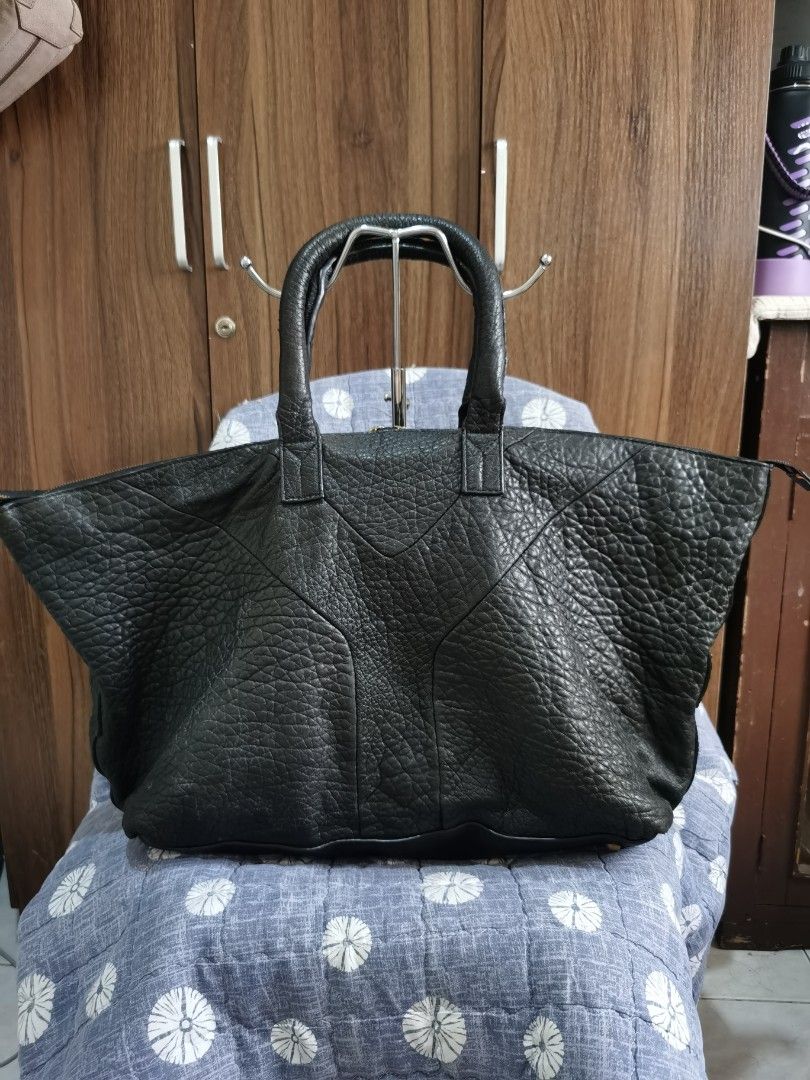 YVES SAINT LAURENT (Category: Tote Bags) located in Bacolod City. Submitted by mzb06 (Listing ID 1466590315, Image 2). Description: SOFT LAMB SKIN LEATHER MATERIAL WITH CODE,Lampo under both zipper.. SPACIOUS LARGE IN SIZE, BEST AS OFFICE BAG,OR COMPUTER BAG OR TRAVEL BAG.. DIMENSION : H 13" / W 21".