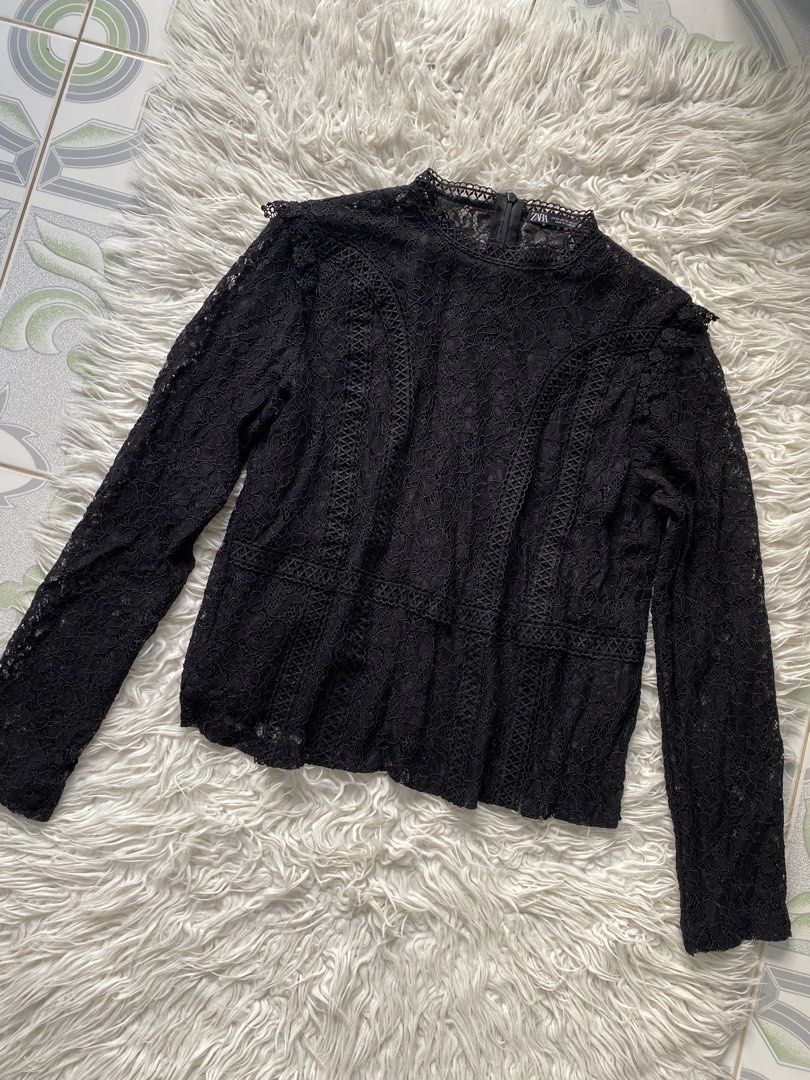 Zara Black Lace Long Sleeve Blouse (Category: Longsleeves) located in Tabaco. Submitted by camila_p (Listing ID 1466772215, Image 2). Description: - Brand: Zara - Size: XS (Made in Cambodia) - Color: Black - Material: Lightweight lace with soft inner lining - Features: Intricate floral lace pattern, long sleeves, high neckline, and back zipper closure - Condition: Brand New, Never use, Tag removed .