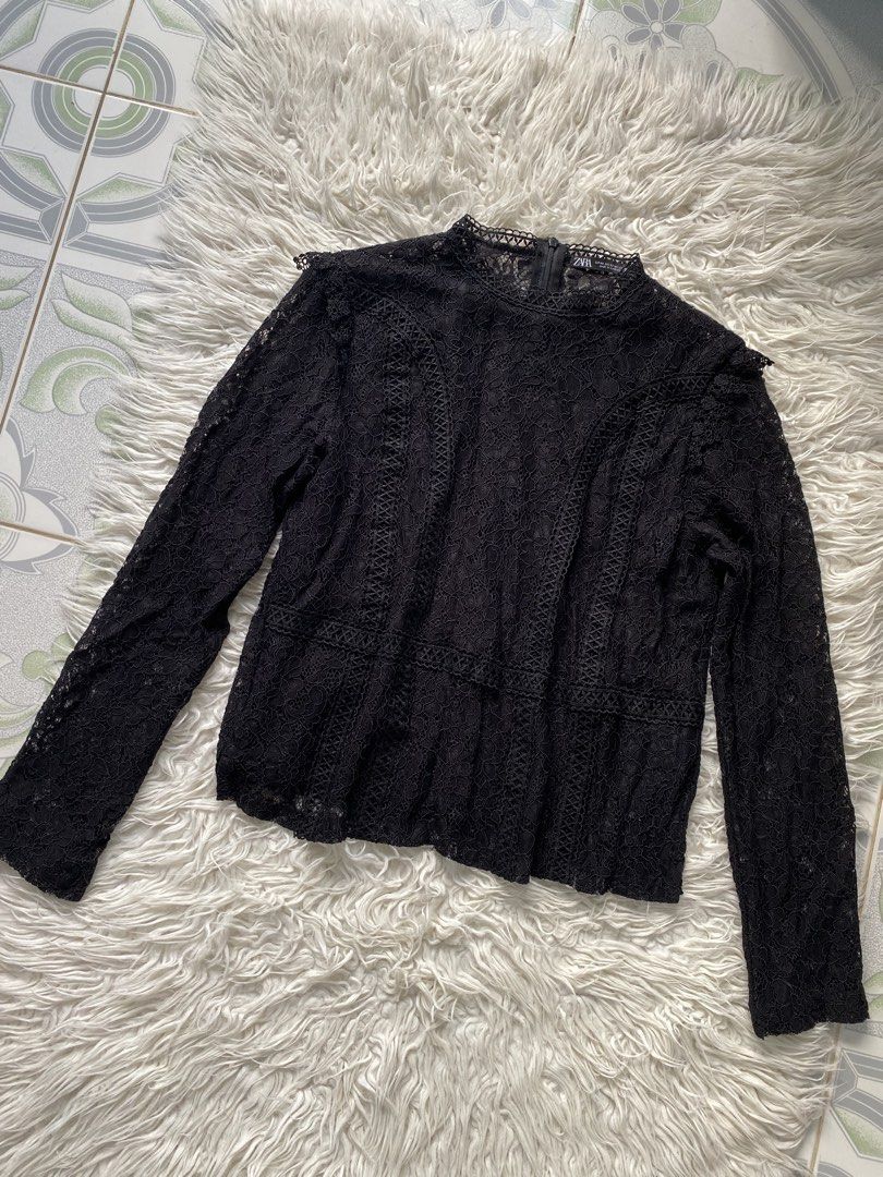 Zara Black Lace Long Sleeve Blouse (Category: Longsleeves) located in Tabaco. Submitted by camila_p (Listing ID 1466772215, Image 1). Description: - Brand: Zara - Size: XS (Made in Cambodia) - Color: Black - Material: Lightweight lace with soft inner lining - Features: Intricate floral lace pattern, long sleeves, high neckline, and back zipper closure - Condition: Brand New, Never use, Tag removed .