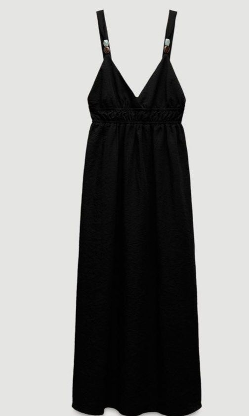 Zara Black Maxi Dress Size S (Category: Dresses) located in Balayan. Submitted by authenticfindsbymrb (Listing ID 1466700268, Image 1). Description: - Brand: Zara black maxi dress - Size: S - Design: V-neckline with decorative bead details on shoulder straps and a deep scoop back - Fit: Smocked elastic waist for a flattering fit and flare silhouette - Fabric: Flowy and lightweight, ideal for casual days or evening outings - Origin: Made in Cambod
