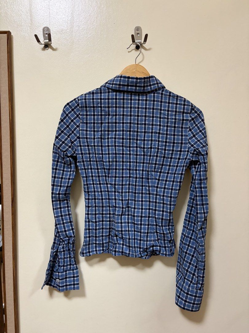 Zara Blue Plaid Long Sleeve Button-Down Shirt (Category: Longsleeves) located in Makati City. Submitted by sbllia (Listing ID 1466610160, Image 2). Description: - Brand: Zara - Size: XS - Color/Pattern: Blue and black plaid - Fit: Fitted cut with curved hem - Details: Button-down front, collar, long sleeves - Origin: Made in Turkey.
