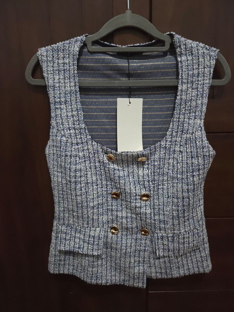 Zara Blue Tweed Vest Size M (Category: Sleeveless) located in Quezon City. Submitted by sashasarisarishoppe (Listing ID 1466673810, Image 1). Description: - Brand: Zara - Style: Double-breasted tweed vest with front patch pockets - Colorway: Blue, white, and black mix with blue and gold striped inner lining - Accents: Elegant gold buttons - Size: Medium (fits true to size) - Condition: Brand new with tags (BNWT).