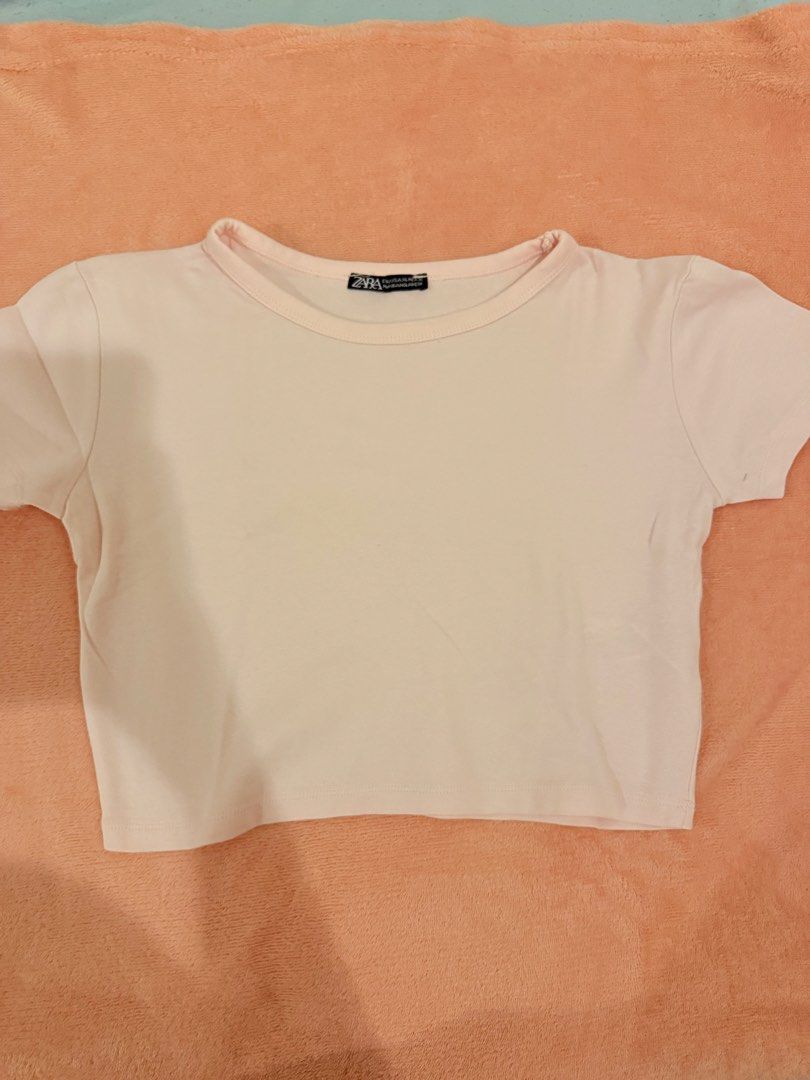 Zara Pink Crop Top Short Sleeve (Category: Shirts) located in Pasig City. Submitted by shop.gelss (Listing ID 1466769923, Image 1). Description: - Brand: Zara - Style: Basic pink crop top with short sleeves and crew neck - Material: Soft cotton - Condition: Worn a few times, washed and stored properly - Fit: True to size - Versatile everyday piece, perfect for high-waisted jeans or skirts.