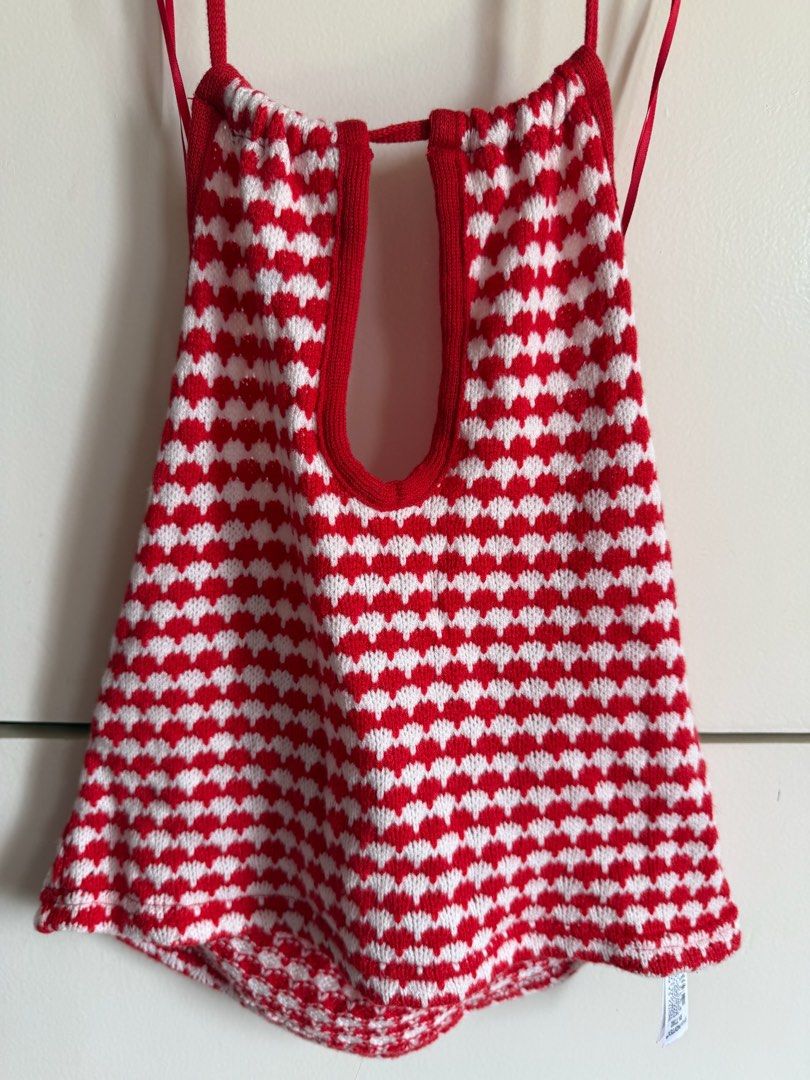 Zara Red and White Knit Halter Top (Category: Sleeveless) located in Quezon City. Submitted by bubspreloved (Listing ID 1466702559, Image 1). Description: - Brand: Zara - Condition: Brand new with tags (BNWT) - Size: S - Color/Pattern: Red and white with all-over heart pattern - Material: Rayon - Features: Halter neck, cutout detail near neckline with thin tie straps.