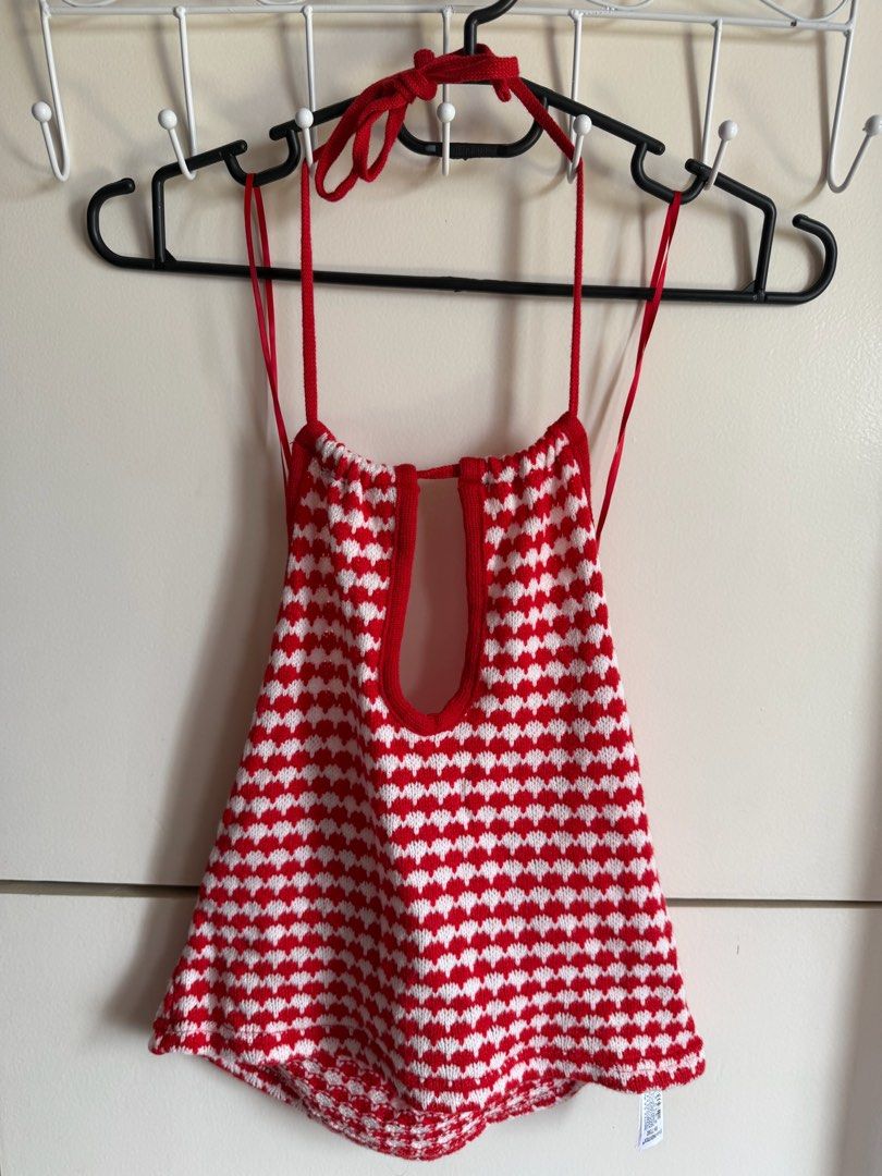 Zara Red and White Knit Halter Top (Category: Sleeveless) located in Quezon City. Submitted by bubspreloved (Listing ID 1466702559, Image 2). Description: - Brand: Zara - Condition: Brand new with tags (BNWT) - Size: S - Color/Pattern: Red and white with all-over heart pattern - Material: Rayon - Features: Halter neck, cutout detail near neckline with thin tie straps.