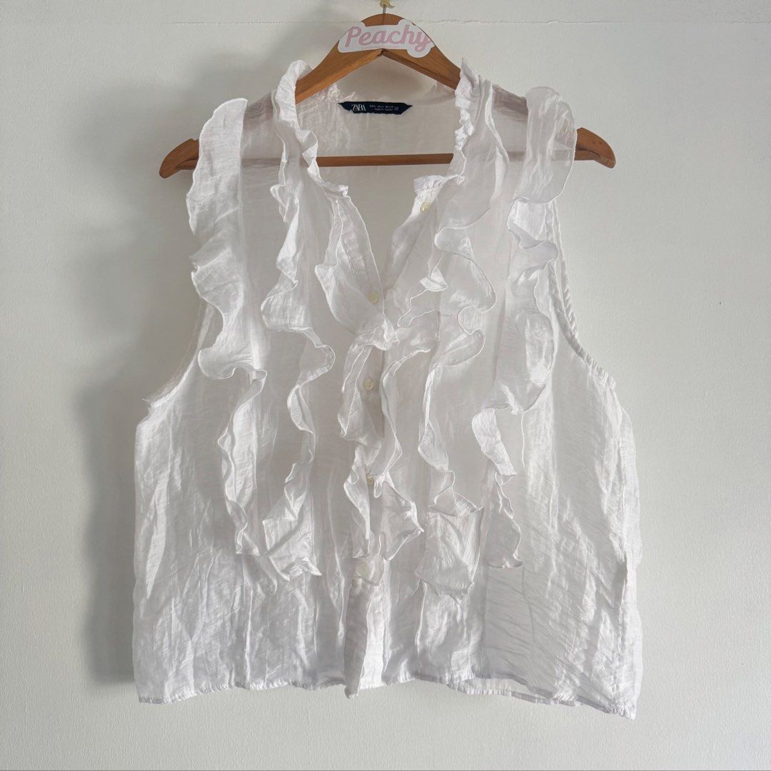 Zara ruffles top (Category: Blouses) located in Manila. Submitted by apparella.ph (Listing ID 1466570571, Image 1). Description: Keep if no one buys Super pretty Used ince in u.s.one of my fave Bust:42 Length:24 ☑️Everything is my Own preloved / BNWT/BNWOT ☑️ not thrifted/Ukay ☑️ malukot sa picture kasi na stock sa cabinet (tinatamad mag plantsa ✌️ ) ☑️Personal items ( usually bought in US/UK/JPN ) every year po ako nag aabroad so expect i don’t 