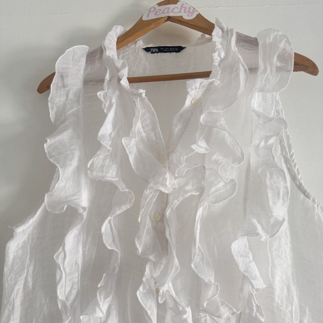Zara ruffles top (Category: Blouses) located in Manila. Submitted by apparella.ph (Listing ID 1466570571, Image 2). Description: Keep if no one buys Super pretty Used ince in u.s.one of my fave Bust:42 Length:24 ☑️Everything is my Own preloved / BNWT/BNWOT ☑️ not thrifted/Ukay ☑️ malukot sa picture kasi na stock sa cabinet (tinatamad mag plantsa ✌️ ) ☑️Personal items ( usually bought in US/UK/JPN ) every year po ako nag aabroad so expect i don’t 