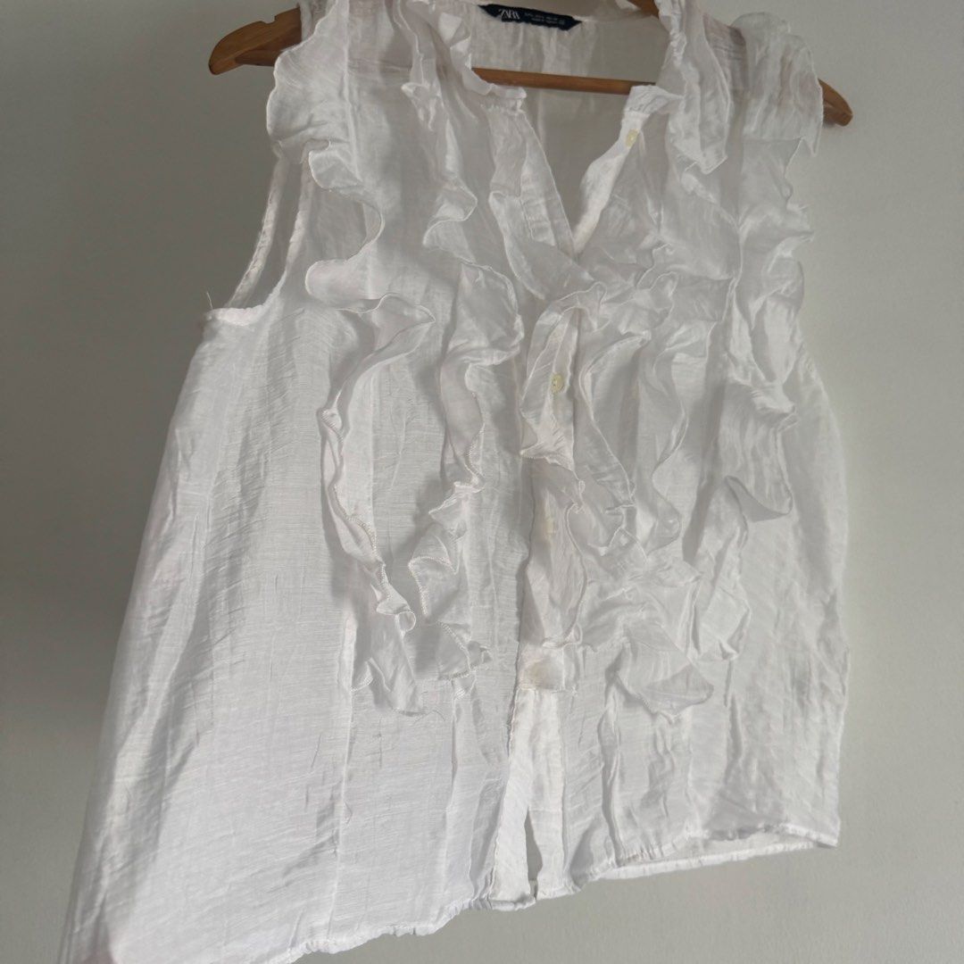 Zara ruffles top (Category: Blouses) located in Manila. Submitted by apparella.ph (Listing ID 1466570571, Image 3). Description: Keep if no one buys Super pretty Used ince in u.s.one of my fave Bust:42 Length:24 ☑️Everything is my Own preloved / BNWT/BNWOT ☑️ not thrifted/Ukay ☑️ malukot sa picture kasi na stock sa cabinet (tinatamad mag plantsa ✌️ ) ☑️Personal items ( usually bought in US/UK/JPN ) every year po ako nag aabroad so expect i don’t 
