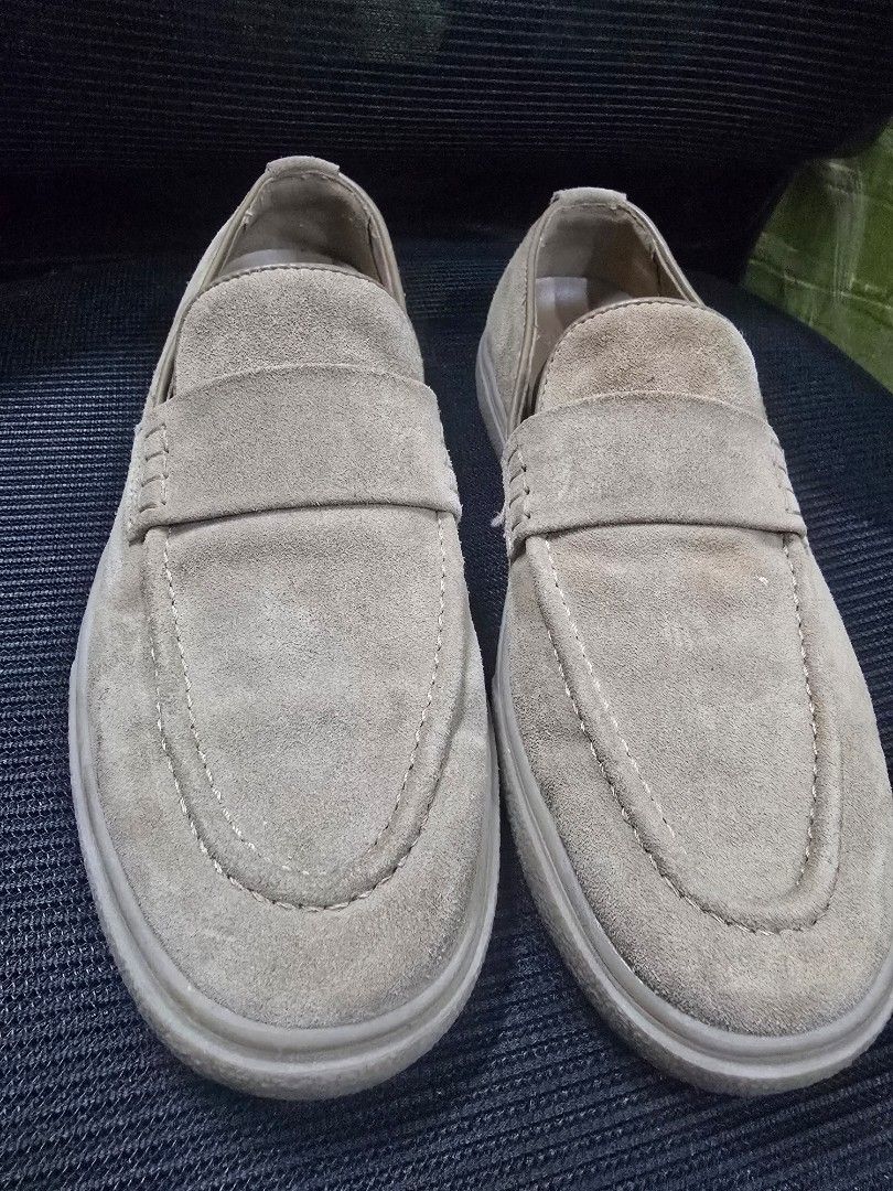 Zara Suede Slip-on Loafers Size 41 (Category: Casual Shoes) located in Manila. Submitted by manilagamers (Listing ID 1466566253, Image 1). Description: - Brand/Model: Zara Suede Slip-On Loafers - Color: Brown - Size: 41 - Design: Classic penny loafer with moc toe stitching and flat rubber sole - Condition: Uppers are in decent shape; bottom soles show dirt and wear from previous use - Style: Convenient slip-on design, perfect for casual everyday 