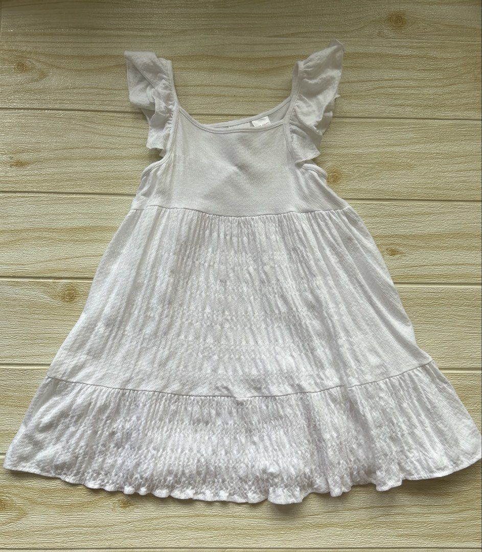 Zara white dress (Category: Babies & Kids Fashion) located in Cebu City. Submitted by yjainani (Listing ID 1466667919, Image 1). Description: White tiered ruffle-sleeve dress for girls with a textured bodice and tiered skirt.