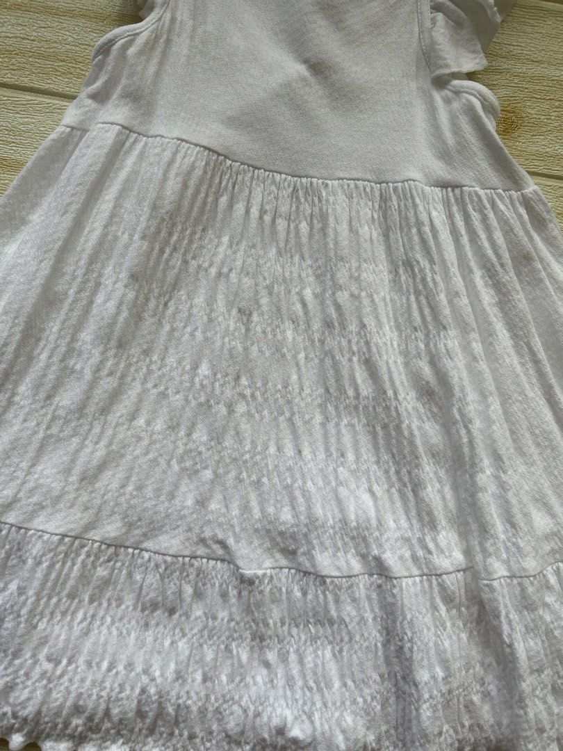 Zara white dress (Category: Babies & Kids Fashion) located in Cebu City. Submitted by yjainani (Listing ID 1466667919, Image 2). Description: White tiered ruffle-sleeve dress for girls with a textured bodice and tiered skirt.