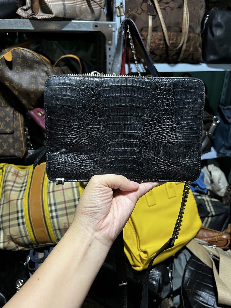 Zarmoi Black Crocodile-Embossed Leather Chain Bag (Category: Luxury Bags & Wallets) located in Manila. Submitted by luckyfire_035e95 (Listing ID 1466564704, Image 1). Description: Zarmqi crossbody bag in black crocodile-embossed leather. Silver hardware throughout, including a chain strap and side accents. Zip closure top. Vibrant purple fabric lining inside with a branded metal label plate. Adjustable and detachable leather strap included too. C