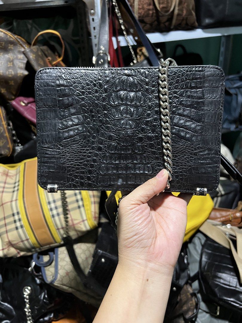 Zarmoi Black Crocodile-Embossed Leather Chain Bag (Category: Luxury Bags & Wallets) located in Manila. Submitted by luckyfire_035e95 (Listing ID 1466564704, Image 2). Description: Zarmqi crossbody bag in black crocodile-embossed leather. Silver hardware throughout, including a chain strap and side accents. Zip closure top. Vibrant purple fabric lining inside with a branded metal label plate. Adjustable and detachable leather strap included too. C