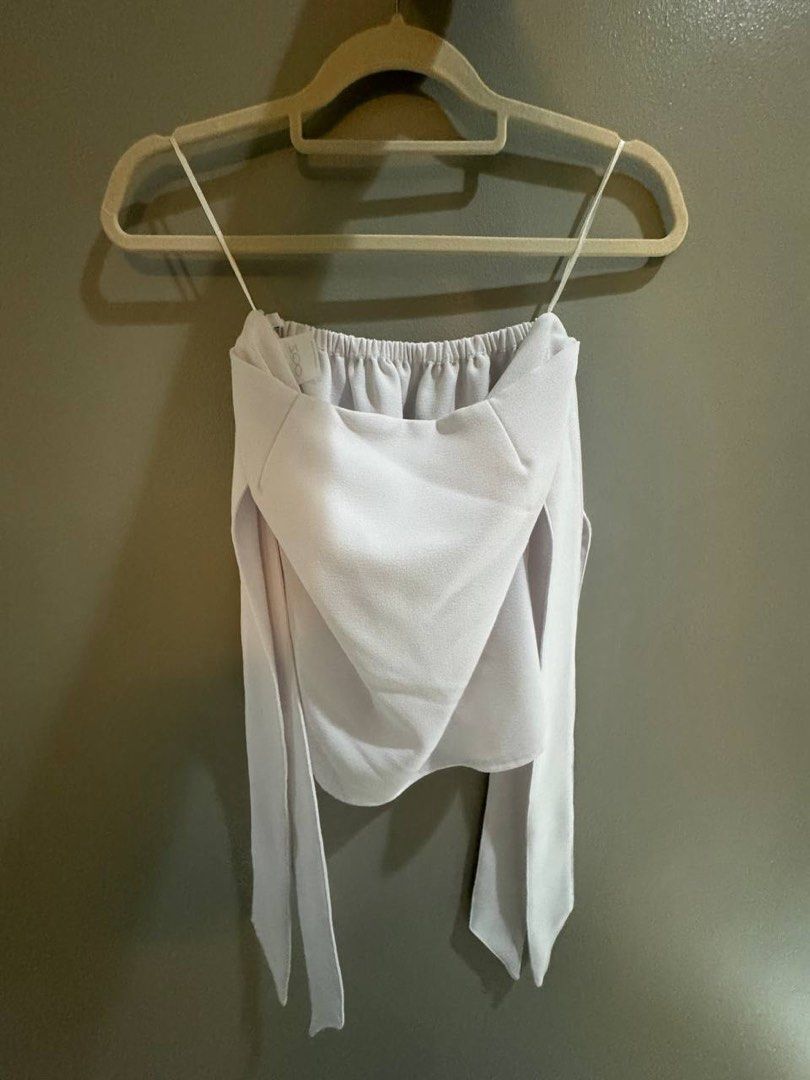 Zoo White Off-Shoulder Top Size M (Category: Blouses) located in Taguig. Submitted by anxmz (Listing ID 1466606584, Image 2). Description: - Brand: Zoo - Size: Medium - Color: White - Style: Off-shoulder with thin straps and draped long sleeves - Material: Lightweight fabric - Origin: Made in the Philippines.