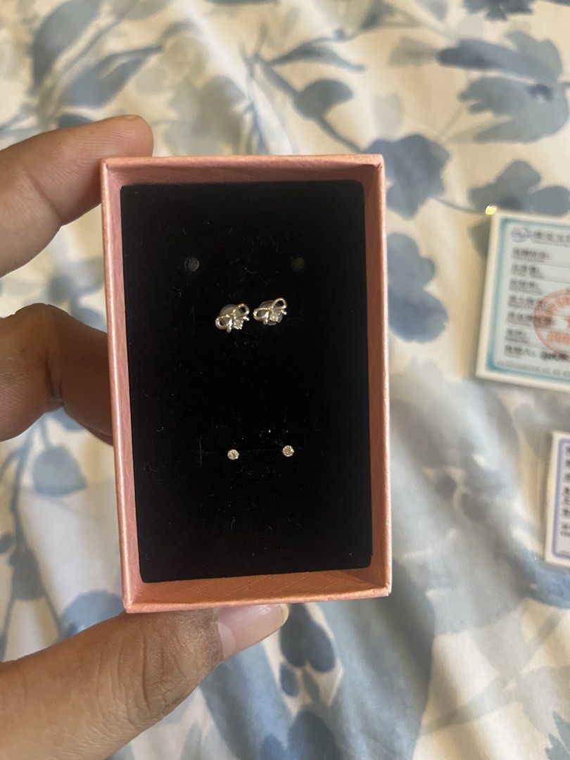 18K Gold Diamond Bow Earrings Set with Certificates (Category: Earrings) located in Las Pinas. Submitted by nursedessa (Listing ID 1466794663, Image 2). Description: - 2 pairs of authentic 18K gold earrings with genuine diamonds - Solitaire pair: 0.14g total mass (0.10 carats diamond) - Bow design pair: 0.37g total mass (0.04 carats diamond) - Verified by official gemstone identification certificates/lab reports - Free pink presentation box inclu