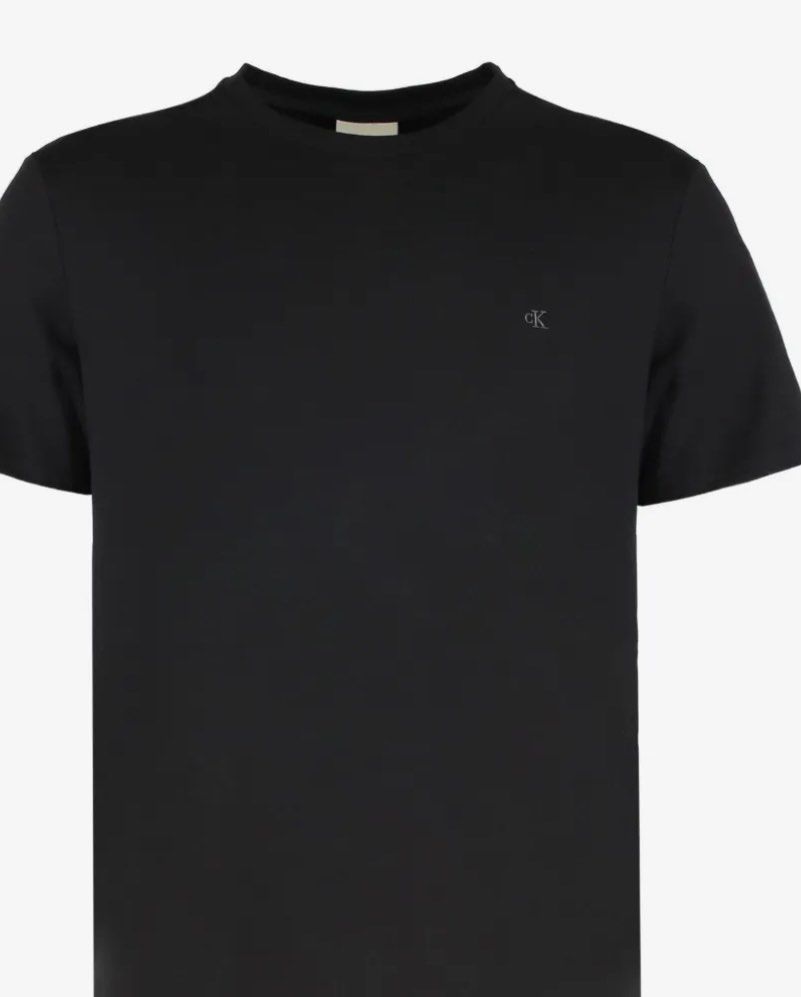 2 Calvin Klein Logo T-Shirt Bundle (Category: Shirts) located in Pasig City. Submitted by thevintagenook (Listing ID 1466932275, Image 1). Description: - Brand: Calvin Klein - Colors available: Black and Purple - Design: Classic embroidered CK logo on the left chest - Fit/Style: Crew neck, short sleeves - Material: Soft and comfortable cotton - Best for: Simple daily wear staple.