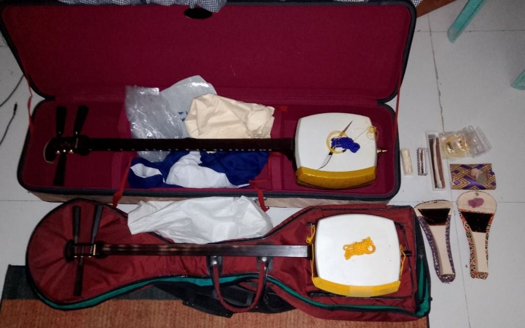 2 Japanese Shamisens with Complete Accessories (Category: Musical Instruments) located in Quezon City. Submitted by eln4rd (Listing ID 1466861795, Image 1). Description: - Futozao Shamisen, front skin is torn, back skin is intact with hard case - Chuuzao Shamisen, both skins intact with soft case - 2 Bekkou Bachis with cases - 2 Ivory Komas - 2 Wood Komas - 3 Shinobi Komas (for silent practice) - Assorted Yubikake - Assorted Extra Strings - Shami