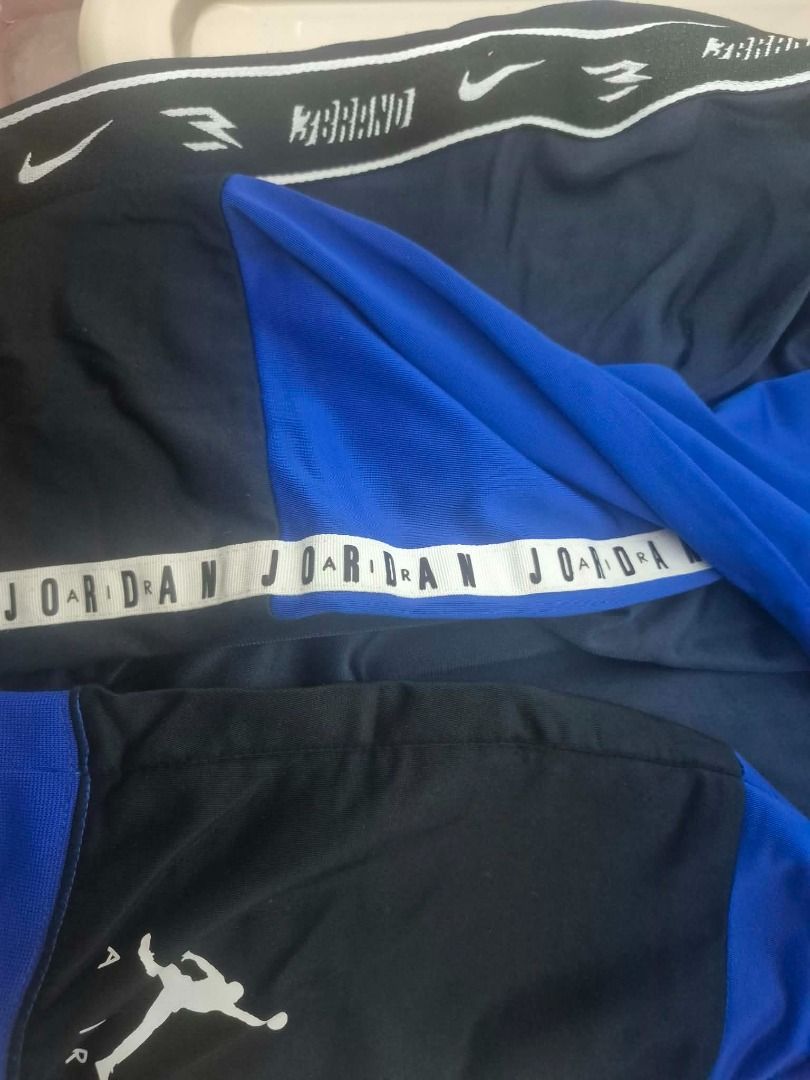 2 pants Jordan Nike Blue Black Athletic Pants (Category: Babies & Kids Fashion) located in Pasig City. Submitted by kathee88 (Listing ID 1466874032, Image 2). Description: - Brand: Jordan - Color: Royal blue and black color blocking with white details - Design: White side tape with 'Jordan' lettering, white Jumpman logo near hem - Waistband: Elastic waistband featuring Nike swoosh and 3brand logos - Material: Lightweight fabric - Condition: Great