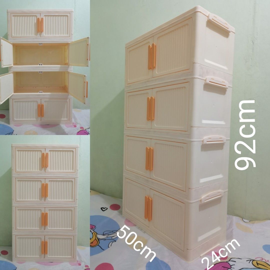 4-Tier Foldable Plastic Storage Cabinet with Doors (Category: Storage Boxes & Baskets) located in Valenzuela. Submitted by nafie330 (Listing ID 1466806715, Image 1). Description: - Color: Creamy white with stylish orange handles - Dimensions: 92 cm (H) x 50 cm (W) x 24 cm (D) - Design: 4-tier stackable, modular setup with textured door panels - Features: Magnetic door closures and a foldable design for easy assembly - Material: Sturdy, durable pl