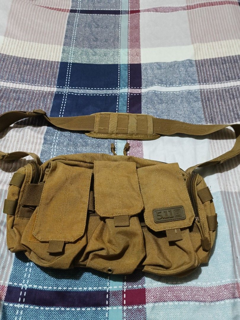 5.11 Tactical Shoulder Sling Bag Brown (Category: Sling Bags) located in Quezon City. Submitted by jdwoah12 (Listing ID 1466818580, Image 1). Description: - Color: Brown - Durable material built for everyday use - Multiple front pockets with velcro flaps for extra gear - Wide-opening main compartment with zipper - Secure zipper pocket at the back - Adjustable shoulder strap with padded cushion for maximum comfort.
