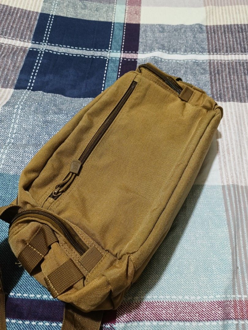 5.11 Tactical Shoulder Sling Bag Brown (Category: Sling Bags) located in Quezon City. Submitted by jdwoah12 (Listing ID 1466818580, Image 3). Description: - Color: Brown - Durable material built for everyday use - Multiple front pockets with velcro flaps for extra gear - Wide-opening main compartment with zipper - Secure zipper pocket at the back - Adjustable shoulder strap with padded cushion for maximum comfort.