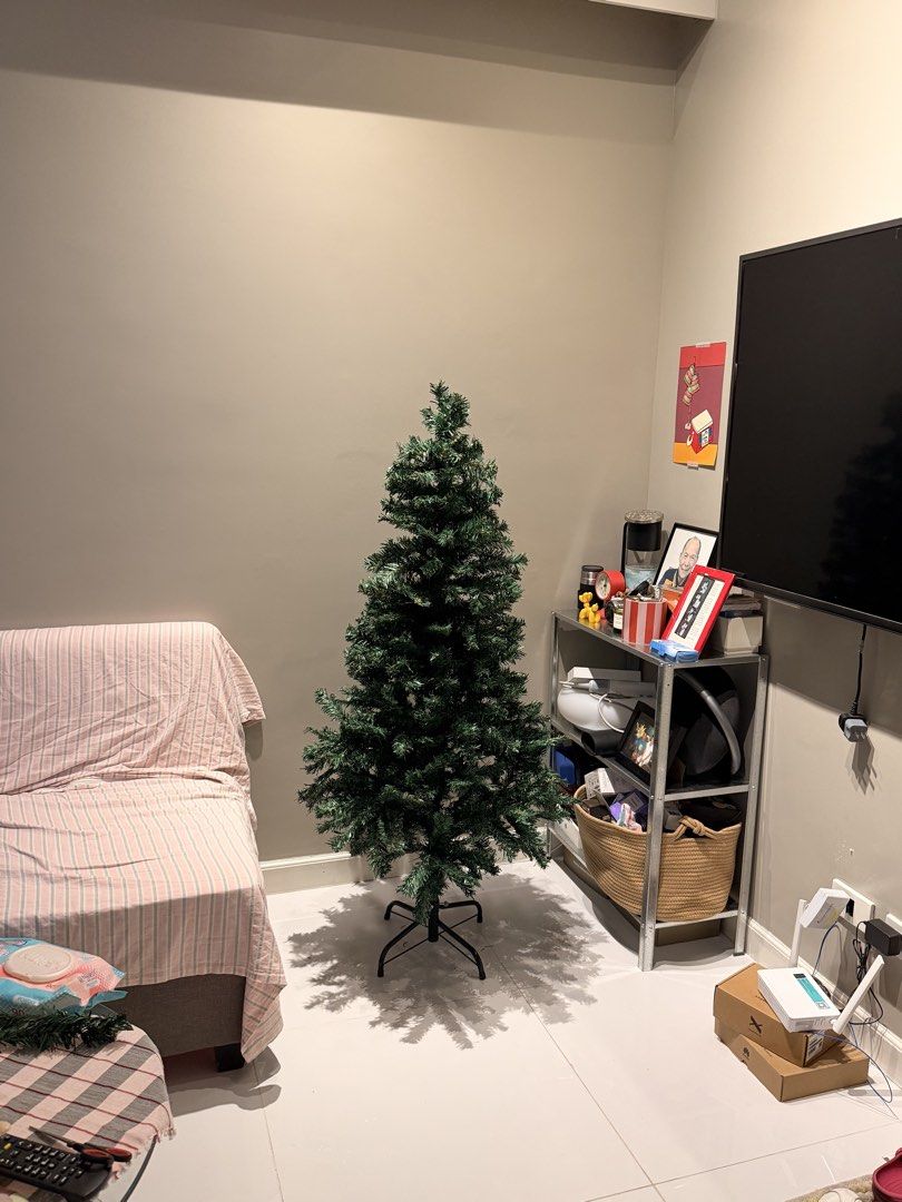 5ft Christmas tree with metal stand (Category: Artificial Plants & Flowers) located in Paranaque City. Submitted by money_juseyo (Listing ID 1466790182, Image 2). Description: brand new bought 1 month ago only assembled but disassembled eventually too big for our space .