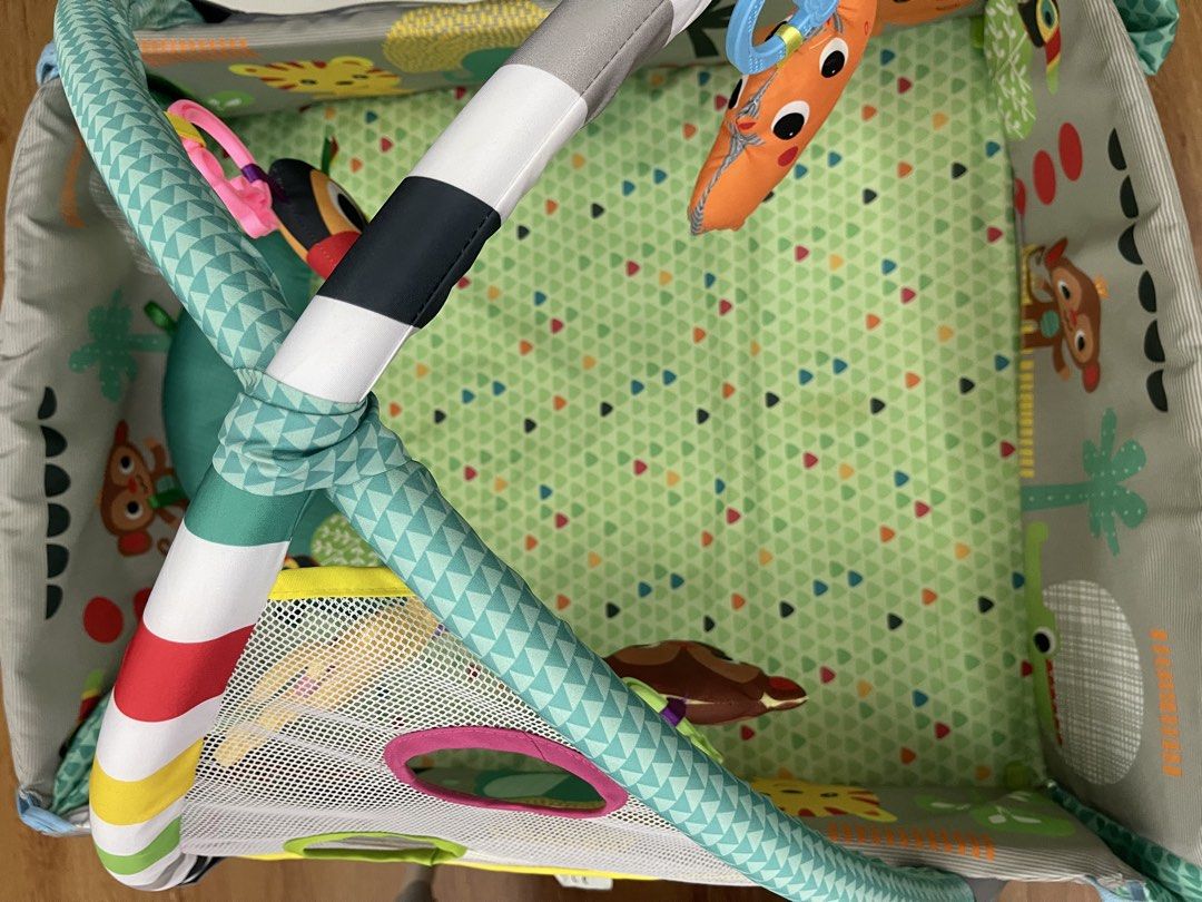 5-in-1 Activity Gym and Ball Pit Jungle Theme (Category: Infant Playtime) located in Pasig City. Submitted by janinemd (Listing ID 1466874458, Image 2). Description: - Theme: Fun jungle design featuring cute animals like monkeys, toucans, and giraffes with colorful geometric prints. - Features: Includes a soft green play mat, arched support bars, hanging plush toys, and a comfy tummy time bolster pillow. - Safety & Comfort: Made with ultra-soft f