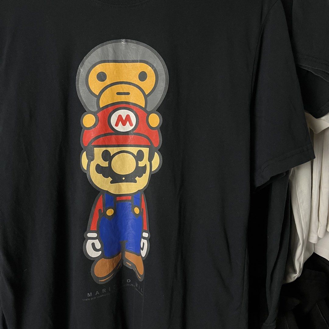 A Bathing Ape (BAPE) x Super Mario (Category: Formal Shirts) located in Daet. Submitted by wearthriftingcloth. (Listing ID 1466932175, Image 2). Description: 👕BAPE Size:M-L Measurement: W21x29 Issue(s): NONE Condition: 9.5/10 Color rate: 9/10 ➡️Swipe- to see more detail pic 📌No Deleting/Cancelation‼️ 📌Color may Vary Due to Lighting‼️ 📌Please be responsible buyer Bogus/Flaker will be posted‼️ 📌All ltems Need Wash‼️.