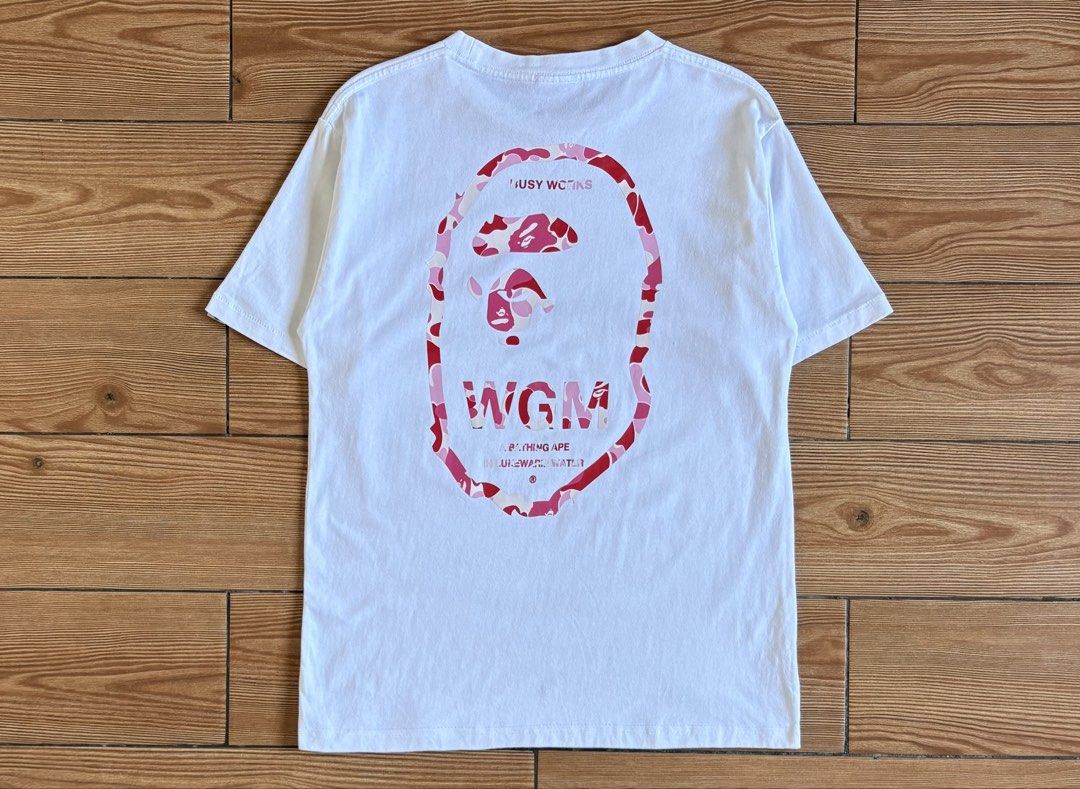 A BATHING APE WGM BIG HEAD LOGO TSHIRT (Category: Tshirts & Polo Shirts ) located in Baras. Submitted by jnc__apparel (Listing ID 1466921217, Image 1). Description: 🏷️ A BATHING APE WGM BIG HEAD LOGO TSHIRT 📌 Dimes: 25.5L x 19.5W 📌 Size: S-M for men ~ Large for womens 📌 Condition: Like new 📌 Color rate: 10/10 📌 Issue: Yellow stain ✅ Washed and ready to wear.