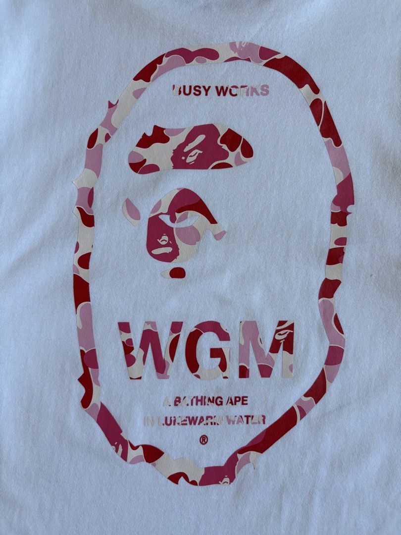A BATHING APE WGM BIG HEAD LOGO TSHIRT (Category: Tshirts & Polo Shirts ) located in Baras. Submitted by jnc__apparel (Listing ID 1466921217, Image 3). Description: 🏷️ A BATHING APE WGM BIG HEAD LOGO TSHIRT 📌 Dimes: 25.5L x 19.5W 📌 Size: S-M for men ~ Large for womens 📌 Condition: Like new 📌 Color rate: 10/10 📌 Issue: Yellow stain ✅ Washed and ready to wear.