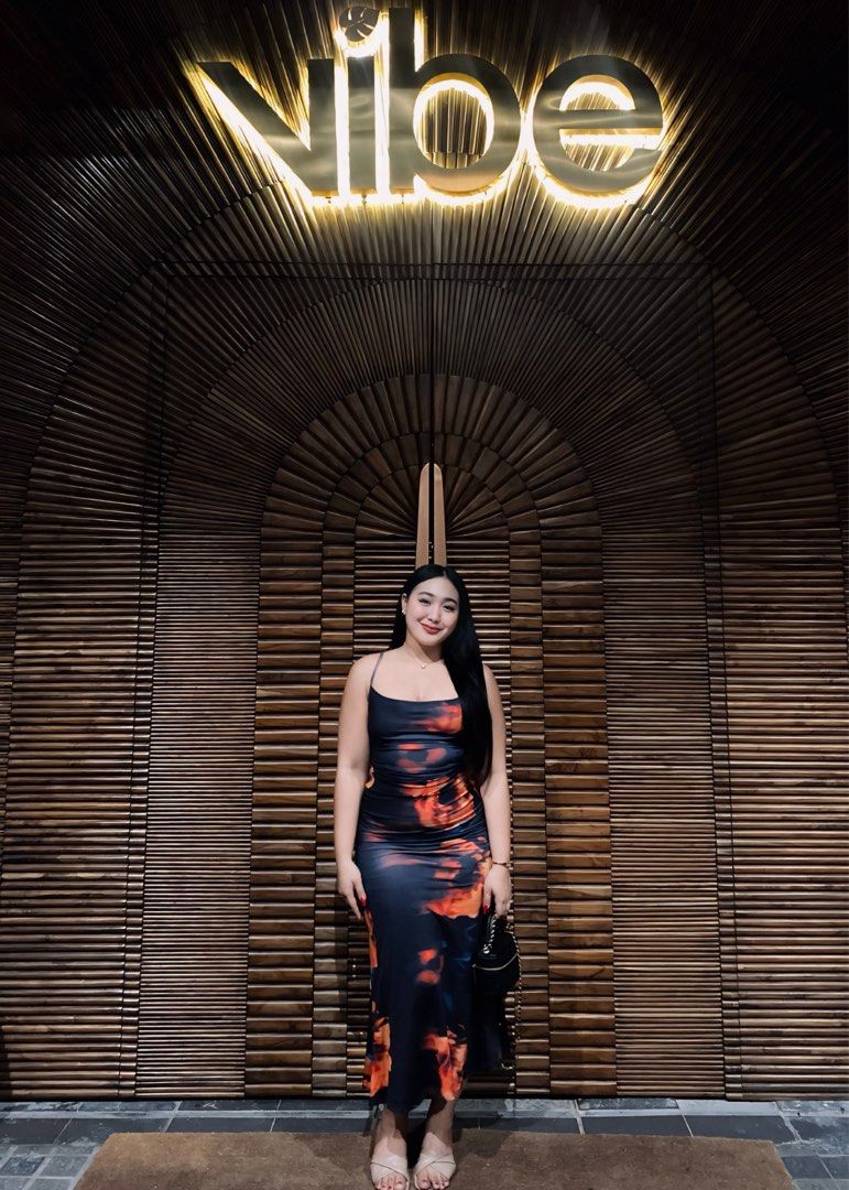 Abstract Fire Print Slip Dress Midi (Category: Dresses) located in Manila. Submitted by pattydeclutters (Listing ID 1466800926, Image 3). Description: - Shein Long dress in Size Medium - Design: Abstract fire pattern in black, orange, and blue - Fit: Smooth, stretchy fabric, hugs your curves with thin spaghetti straps and a draped cowl neckline - Perfect for parties, dinner, beach.