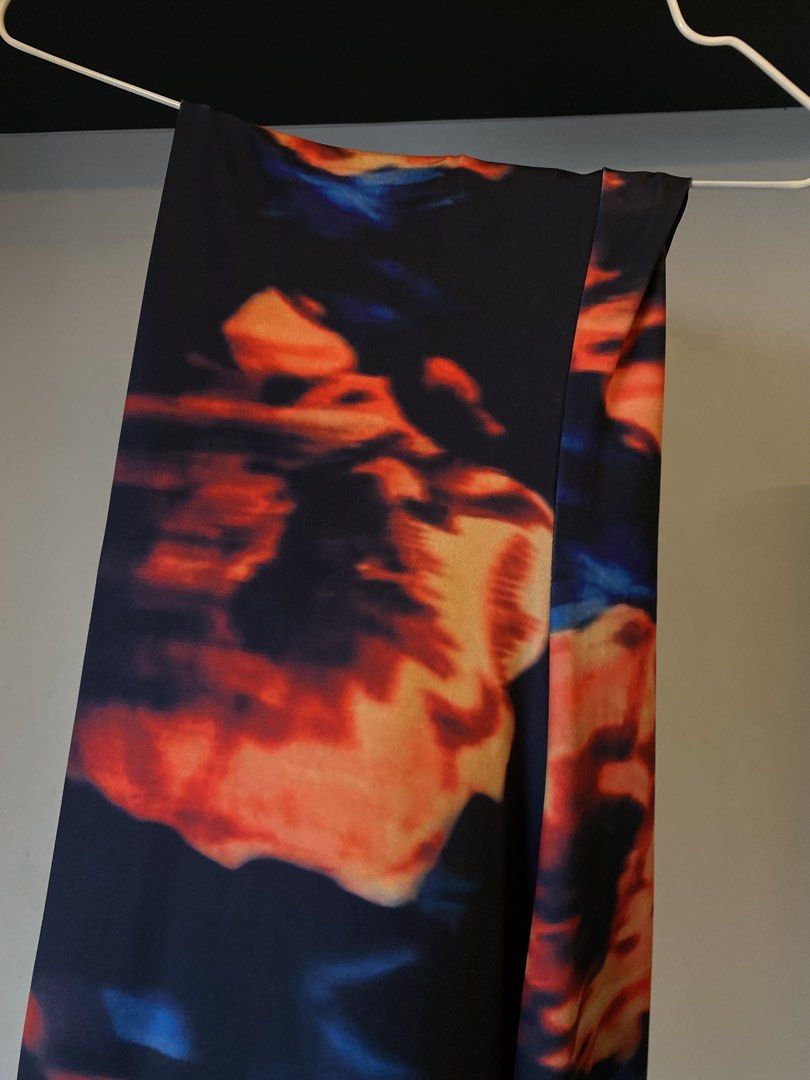 Abstract Fire Print Slip Dress Midi (Category: Dresses) located in Manila. Submitted by pattydeclutters (Listing ID 1466800926, Image 2). Description: - Shein Long dress in Size Medium - Design: Abstract fire pattern in black, orange, and blue - Fit: Smooth, stretchy fabric, hugs your curves with thin spaghetti straps and a draped cowl neckline - Perfect for parties, dinner, beach.