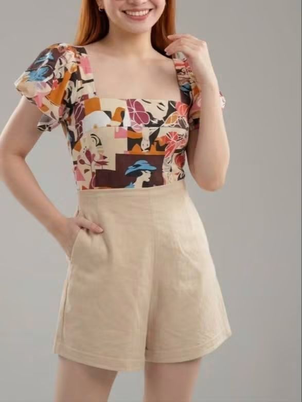 Abstract print square neck top with beige shorts (Category: Sets or Coordinates) located in Binan City. Submitted by bryleonlineshop16 (Listing ID 1466941701, Image 1). Description: - 2-piece matching set for effortless styling - Top: Square neckline, colorful abstract print, puff sleeves - Bottoms: Solid beige, high-waisted, with functional side pockets - Perfect for daytime wear, brunch, or casual errands - Versatile pieces that can be mixed an