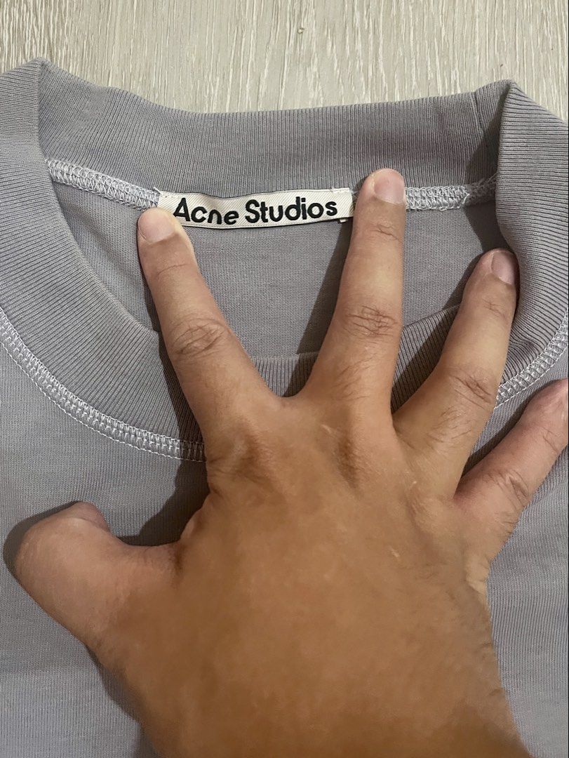 Acne Studios small logo tee blue grey (Category: Tshirts & Polo Shirts ) located in Marikina City. Submitted by menggufinds (Listing ID 1466932364, Image 3). Description: For Sale: Acne Studios small logo tee Color: blue grey Condition: 9.5/10 Issue: cut washtag Size: Small Dimensions: L: 27in W: 20in.