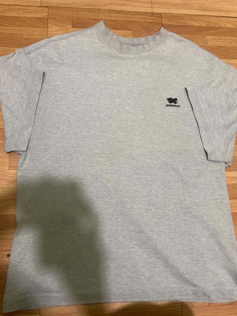 Ader Error Logo T-Shirt 'Grey' (Category: Tshirts & Polo Shirts ) located in Lal-Lo. Submitted by keenlion_7de5f3 (Listing ID 1466963287, Image 1). Description: -Dimes: 22W by 28.5L -Size:M to L -good condition -negotiable -+sf -Payment first before ship -Mop:GCush -Ship by jnt.