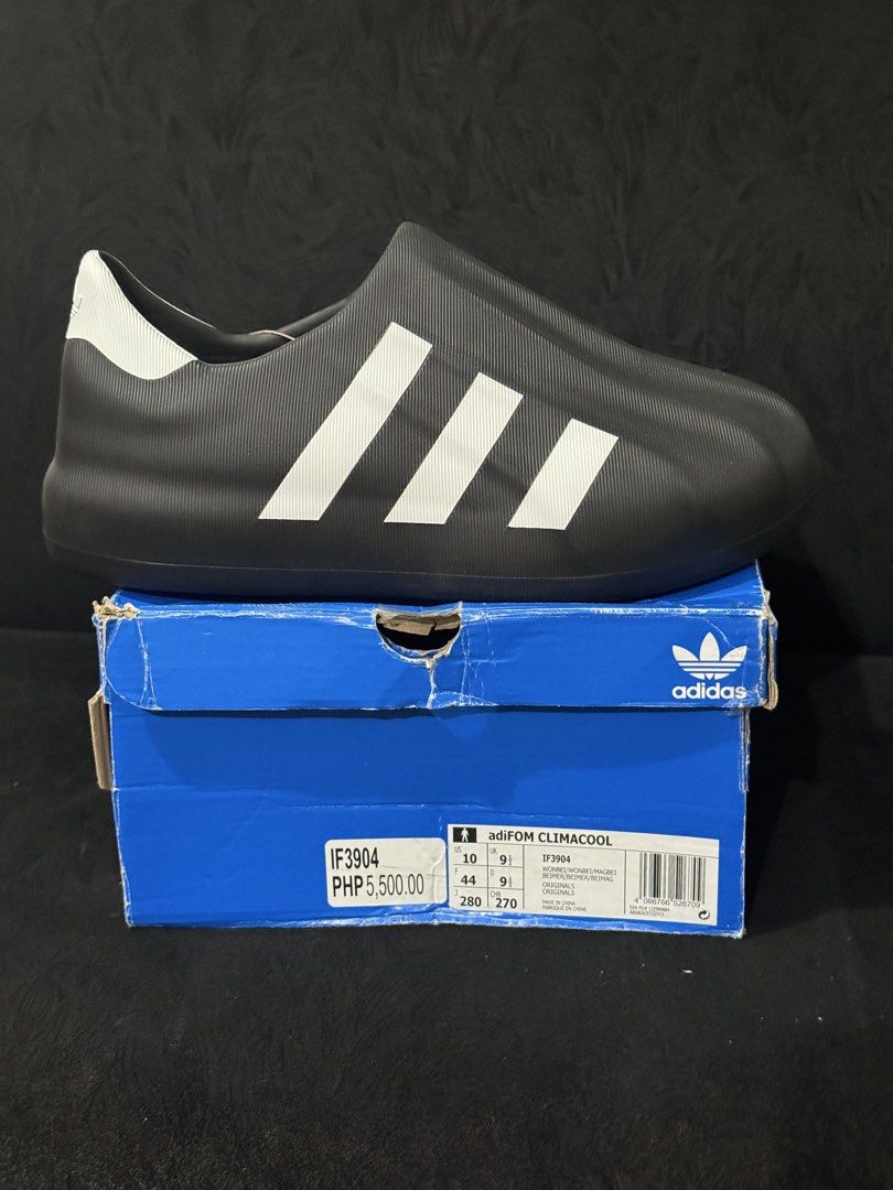 Adidas adiFOM Climacool Black White (Category: Sneakers) located in Rodriguez. Submitted by leo_mjjmpj (Listing ID 1466848254, Image 1). Description: - Brand: Adidas adiFOM Climacool slip-on sneakers - Colorway: Black body with iconic white three stripes and heel detail - Size: US 10 / UK 9.5 / EU 44 - Condition: Excellent pairs, includes original blue Adidas shoebox (box has minor edge wear from storage) - Perfect for daily casual wear and ultim