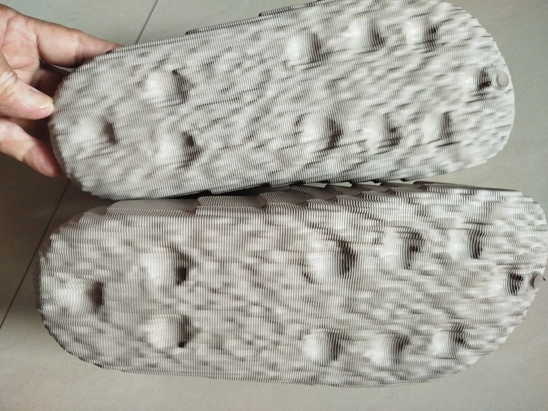Adidas Adilette 22 Slides Gray (Category: Slippers & Slides) located in Batangas. Submitted by nolram04 (Listing ID 1466811237, Image 2). Description: - Brand/Model: Adidas Adilette 22 Slides - Color: Off White - Design: Unique topographical ridged texture on strap and footbed with embossed trefoil logo - Features: Lightweight build, slip-on comfort, and textured outsole for extra grip - Condition: Clean overall, minimal signs of handling, ready 