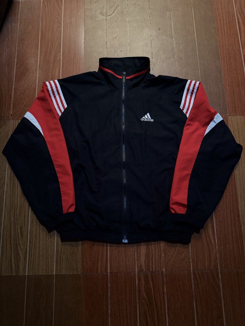 Adidas Black Red White Track Jacket (Category: Coats, Jackets and Outerwear) located in Dasmarinas. Submitted by kylebecker (Listing ID 1466951474, Image 1). Description: - Authentic black Adidas track jacket - Bold red and white sleeve stripes with matching red collar piping - White embroidered Adidas logo on right chest - Full zip front closure with snug ribbed cuffs and hem - Versatile sporty layer for daily wear, gym, or casual outings.