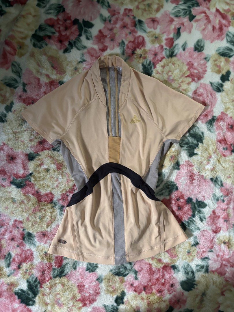 Adidas Climacool Peach and Grey Athletic Top (Category: Activewear) located in Davao. Submitted by curatedfindx (Listing ID 1466782522, Image 1). Description: Peach and grey Adidas athletic top with black contrast and a V-neck. Features breathable mesh panels, a gold logo, and Climacool tech. Fitted short-sleeve style. small-med.