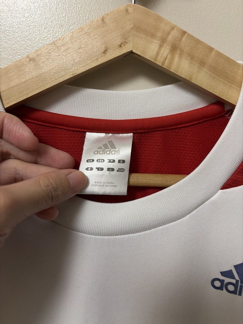 Adidas Climacool Athletic Drifit Shirt (Category: Shirts) located in Paranaque City. Submitted by theartoflettinggo (Listing ID 1466906155, Image 2). Description: Adidas athletic t-shirt in white with red and navy blue detailing. Size S on the tag (19x24) Climacool technology for workouts or running. Classic three stripes on both sleeves. Clean overall except for one faint tiny dot stain on the back right sleeve. .