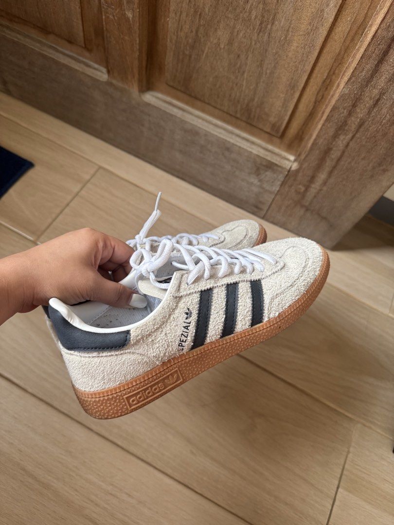 Adidas Spezial Sneakers (Category: Sneakers) located in Manila. Submitted by micaaaaac (Listing ID 1466970659, Image 3). Description: - Brand: Adidas Spezial - Colorway: Cream and black with classic white laces - Material: Premium shaggy suede upper with durable gum soles - Details: Iconic three stripes and gold Spezial lettering on the sides - Interior: White insoles with repeating Adidas branding - Style: Versatile low-top sneakers, perfect for