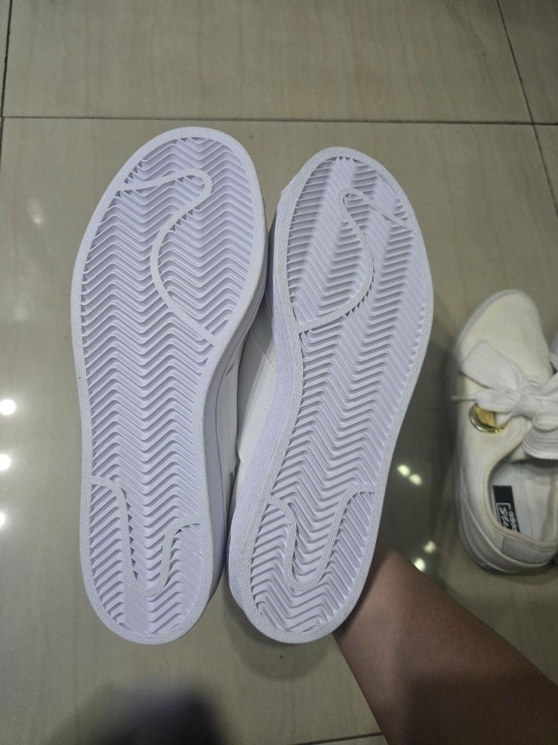 Adidas White Slip-On Sneaker Bundle (Category: Sneakers) located in Manila. Submitted by brandedshoppe_mnl (Listing ID 1466924260, Image 3). Description: 100% Original adidas sneakers -Unused/Shoes only, no box -Two pairs of white Adidas slip-on sneakers. One pair has thick laces tied in big bows with gold hardware accents. The other pair features wide elastic cross straps over the top and shell toes. -Both are size US 8, clean white canvas and r