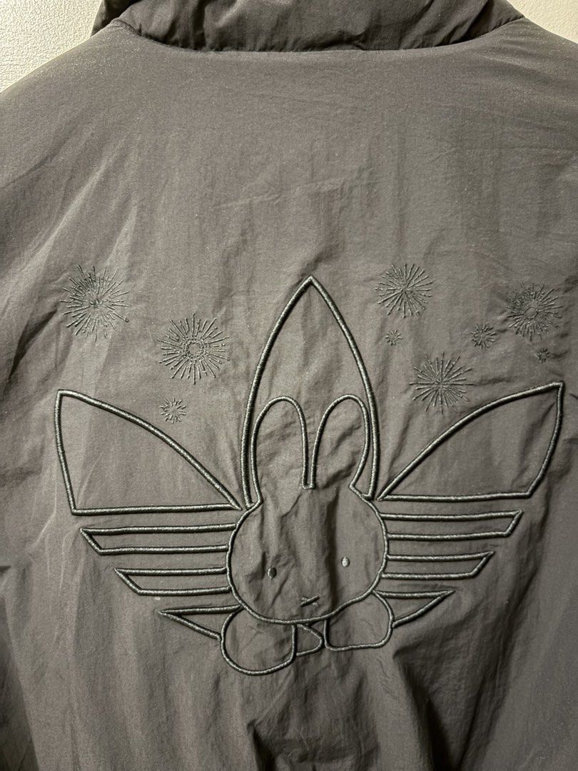 Adidas x Miffy Padded Jacket (Category: Coats, Jackets and Outerwear) located in Paranaque City. Submitted by theartoflettinggo (Listing ID 1466901991, Image 3). Description: Collaborative Adidas and Miffy padded jacket in black with vibrant red inner lining. Features an embroidered Miffy rabbit silhouette inside the trefoil logo on the back, plus unique collab tag on the sleeve. Zips up front, high collar, relaxed fit. Asia sizing medium, fits t