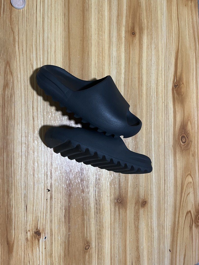 Adidas Yeezy Slides Onyx Size 6 US (Category: Slippers & Slides) located in Naga. Submitted by stoob.finds (Listing ID 1466806655, Image 1). Description: - Brand/Model: Adidas Yeezy Slides - Colorway: slate gray - Size: 6 US -23cm - Condition: Lightly used with minimal signs of wear on soles and upper - Design: Slip-on style featuring a textured footbed, iconic serrated outsole, and subtle branding on the heel and inner strap - Deal: Ships fast f