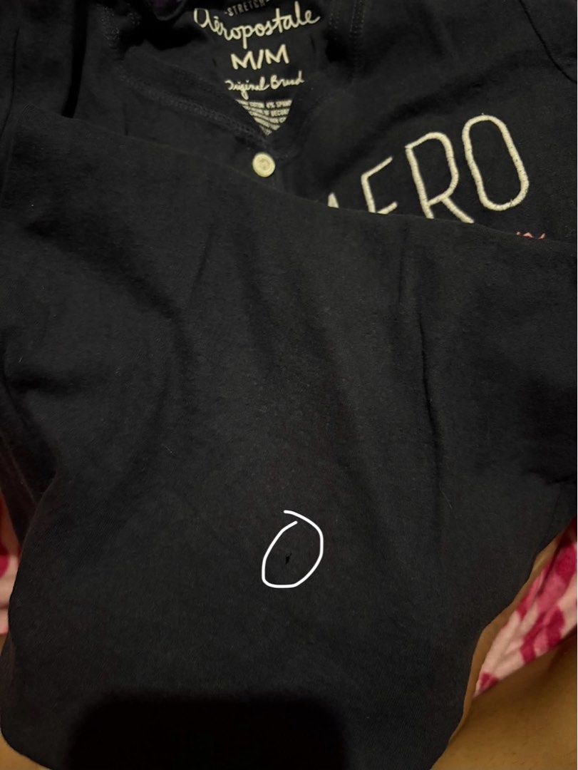 Aeropostale Henley Navy Blue (Category: Blouses) located in Cagayan de Oro. Submitted by _wh0reforjuicy (Listing ID 1466968489, Image 2). Description: - Brand: Aeropostale - Size: Small to Medium MM on tag - Color: Dark blue with white 'AERO' and sparkly pink 'NY' print - Details: Short sleeves, scoop neckline, button-up front accent - Flaw: Small hole near the bottom hem area - Perfect for casual everyday wear!.